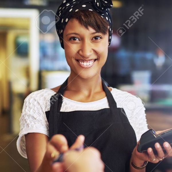 46626282-smiling-waitress-or-small-business-owner-taking-a-credit-card-from-a-customer-to ...